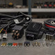 Generic relay, voltage regulator, wiring harness, and electrical parts on a workbench
